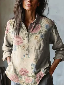 Detailed macro view of women's vintage floral print blouse with buttons and pocket.