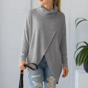 Stylish women's grey cowl neck long sleeve knit sweater featuring a wrap front hem