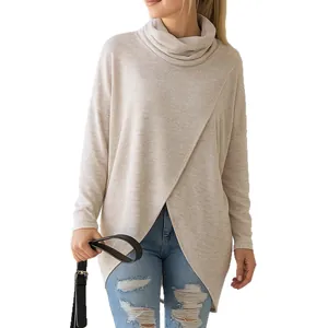 Casual loose beige knit sweater featuring a stylish turtleneck and crossover hem for women