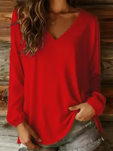 Half-body view of a vibrant red casual loose V-neck long-sleeve blouse for women