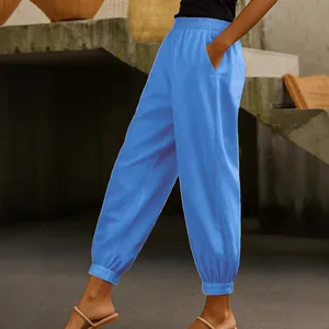 Pantaloni alla moda in cotone e lino blu con elastico in vita e tasche per donna.