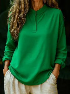 Elegant women's loose bright green long-sleeve blouse featuring a stylish stand collar design