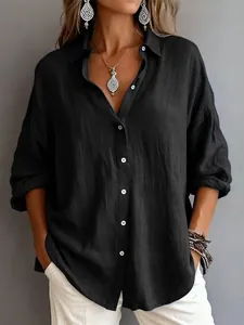 Casual women's loose black long sleeve button down shirt with textured linen look.