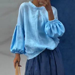 Élégant chemisier bleu clair à manches longues et amples avec design manches lanterne femme
