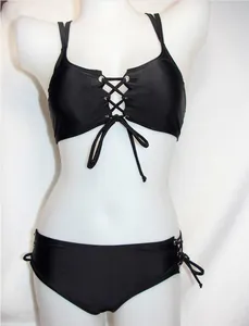 Detail shot showing the front lace-up design of this sexy black two-piece bikini set