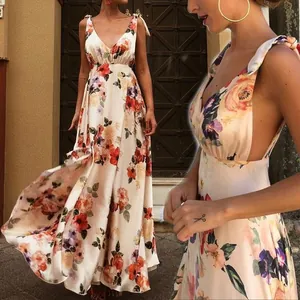 Detailed side view of bohemian floral maxi dress with backless V-neck design.