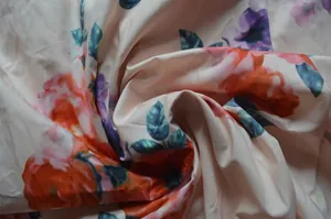 Close-up view of bohemian floral print fabric with vibrant colors and soft texture detail