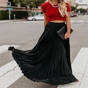 Full-length view of a black pleated maxi skirt with elegant high-waisted flow