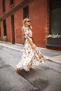 Elegant floral Bohemian maxi dress with a brown belt and long sleeves in street style