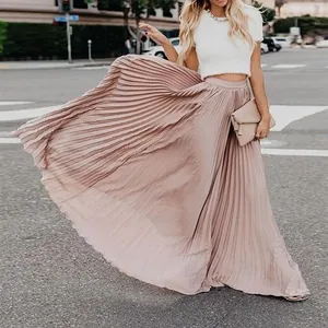 Elegant high-waisted pleated maxi skirt with a flowing A-line silhouette in blush pink