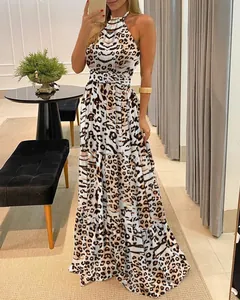 Leopard print halter neck maxi dress with cinched waist and tiered flowy skirt