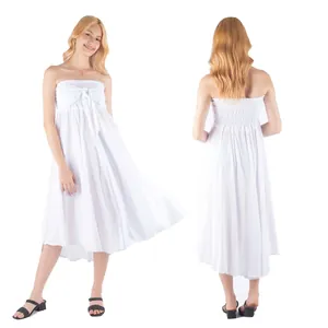 Elegant white strapless summer beach dress featuring smocked bodice and tie front detail