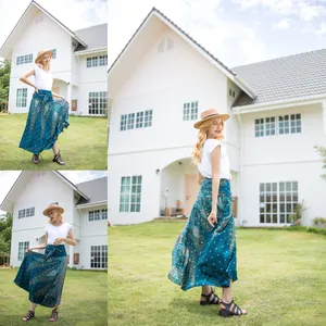 Detailed view of women's boho peacock print wrap skirt with tie-waist detail