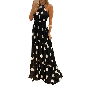 Elegant black and white polka dot halter-neck maxi dress for women in stylish summer look