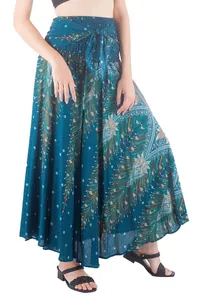 Detailed view of a teal bohemian maxi skirt with peacock feather print and tie waist.
