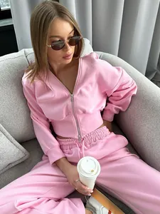 Close-up of pink two-piece tracksuit set with zip-up hoodie and sweatpants
