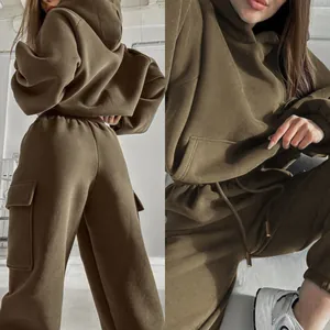 Detailed close-up view of olive green hoodie and cargo sweatpants set with pocket details