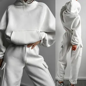 Front and back detail views of a white oversized hoodie and matching cargo jogger pants