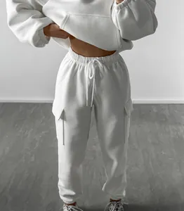 Detail of women's white hoodie and matching cargo jogger pants sweatsuit set