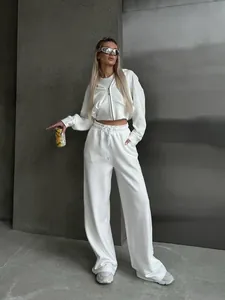 Women's 2 piece lounge set featuring white zip-up hoodie and wide-leg drawstring pants.
