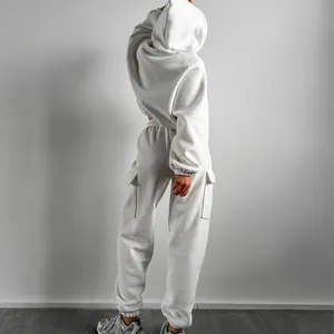 Back view detail of a women's cozy white fleece hoodie and cargo jogger tracksuit set