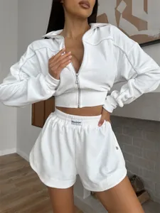 White velvet lounge set featuring a zip-up cropped jacket and elastic waist shorts