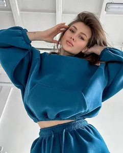 Model wearing a stylish teal blue autumn winter sports casual hoodie and joggers set