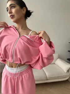 Fashionable pink two-piece leisure set for women with zip-up hoodie and matching pants