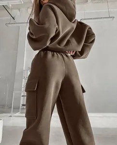 Detailed back view of a woman wearing a brown oversized hoodie and matching cargo joggers set