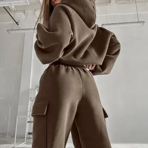 Detailed view of women's oversized brown hoodie and cargo jogger pants tracksuit set.