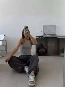 Fashionable streetwear loose-fit drawstring joggers for women in minimalist charcoal grey
