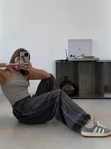American street style loose grey sweatpants for women featuring a comfortable elastic waist.