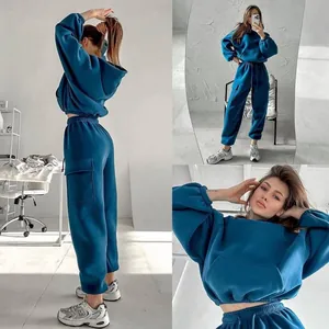 Fashionable teal oversized cropped hoodie and cargo sweatpants set for stylish women