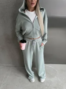 Women's sage green tracksuit featuring cropped zip-up hoodie and matching drawstring pants