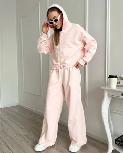 Lichtroze casual sportset voor dames met hoodie met rits en broek met wijde pijpen