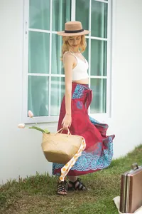 Bohemian red printed maxi skirt for beach vacations with lace-up waist detail.