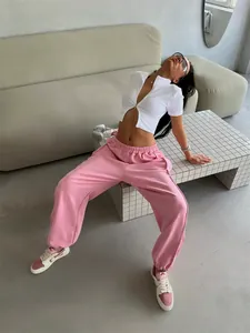 Detailed view of pink American street style loose sweatpants with elastic waist and baggy fit