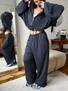 Dark grey women's 2-piece lounge set with cropped zip-up hoodie and wide-leg joggers