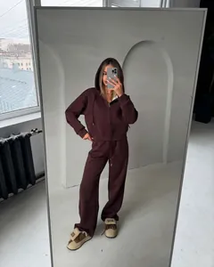 Full-body mirror selfie showing a cozy brown zip-up hooded tracksuit set for women