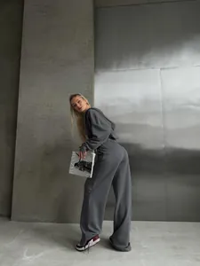 Stylish women's grey two-piece casual tracksuit set with zip hoodie and wide-leg pants