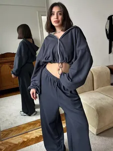 Full view of women's 2-piece grey tracksuit with zip hoodie and wide-leg trousers.
