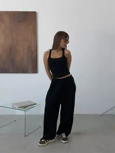 Full view detail of black baggy streetwear sweatpants with elastic waist for women