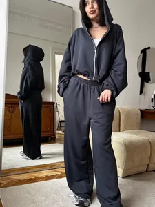 Casual dark grey two-piece tracksuit with zip-up hoodie and wide-leg sweatpants
