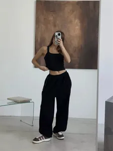 American street style loose black sweatpants for women, casual baggy fit with elastic waist.