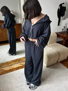 Detailed view of a charcoal grey women's hooded sweatshirt and jogger pants set.