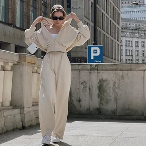 Stylish beige two-piece casual tracksuit set with a zip-up hoodie and wide-leg pants
