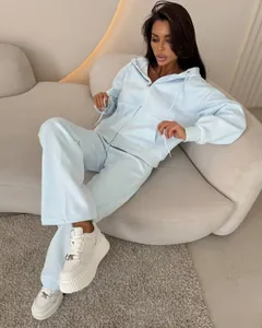 Detail view of light blue two-piece sports tracksuit set with zip-up hoodie and pants