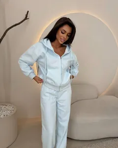 Detailed view of women's pastel blue tracksuit with zip-up hoodie and drawstring pants