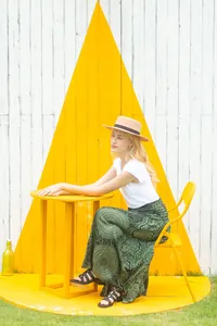 Lifestyle view showing the drape and flow of the printed green bohemian maxi skirt