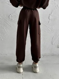 Back view of brown cargo joggers set with pockets and elastic cuffs